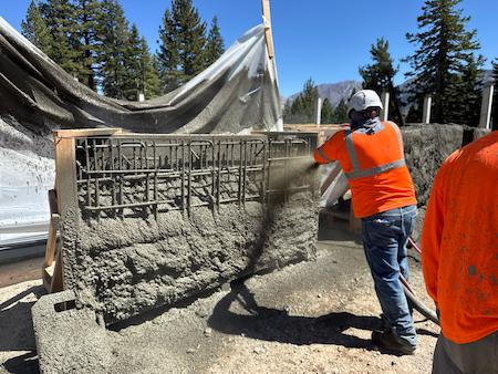 Shotcrete being poured for a commercial project.